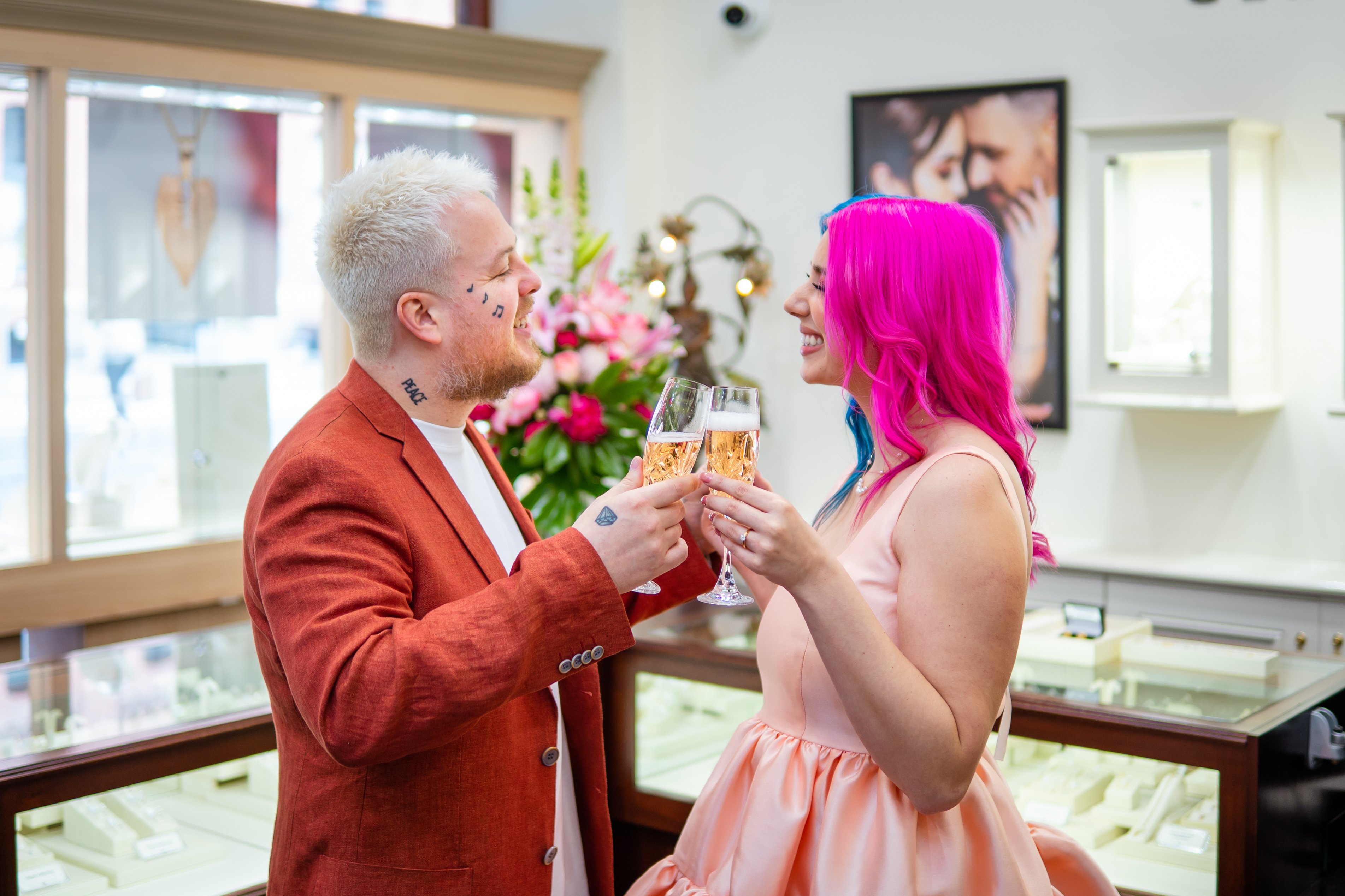 Jenna dnd Yorke celebrating their engagement in our Adelaide Arcade boutique.